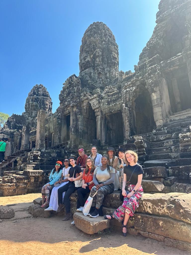 Students sitting at Angkor Wat
