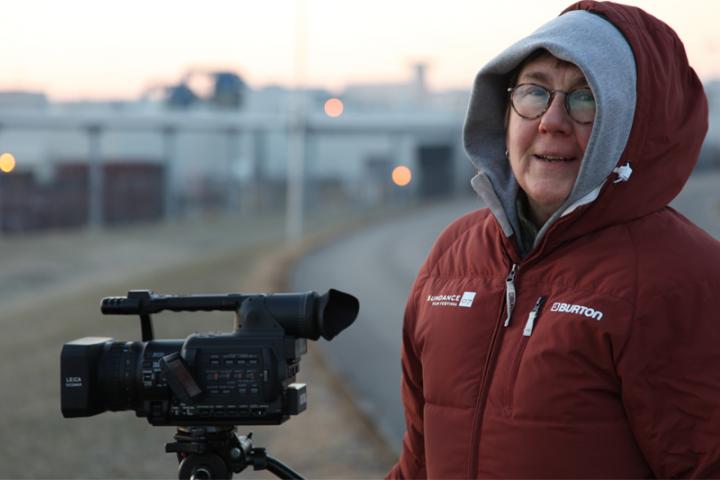 Academy Award-winning documentarian Julia Reichert filming in the cold.  