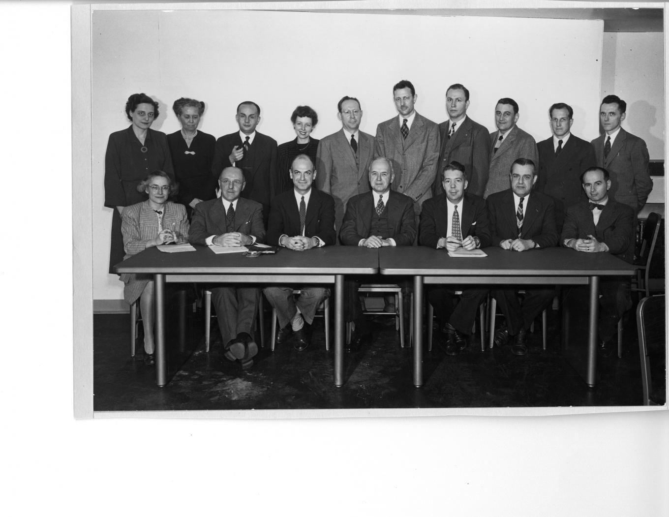 Photo of many founding faculty at a table