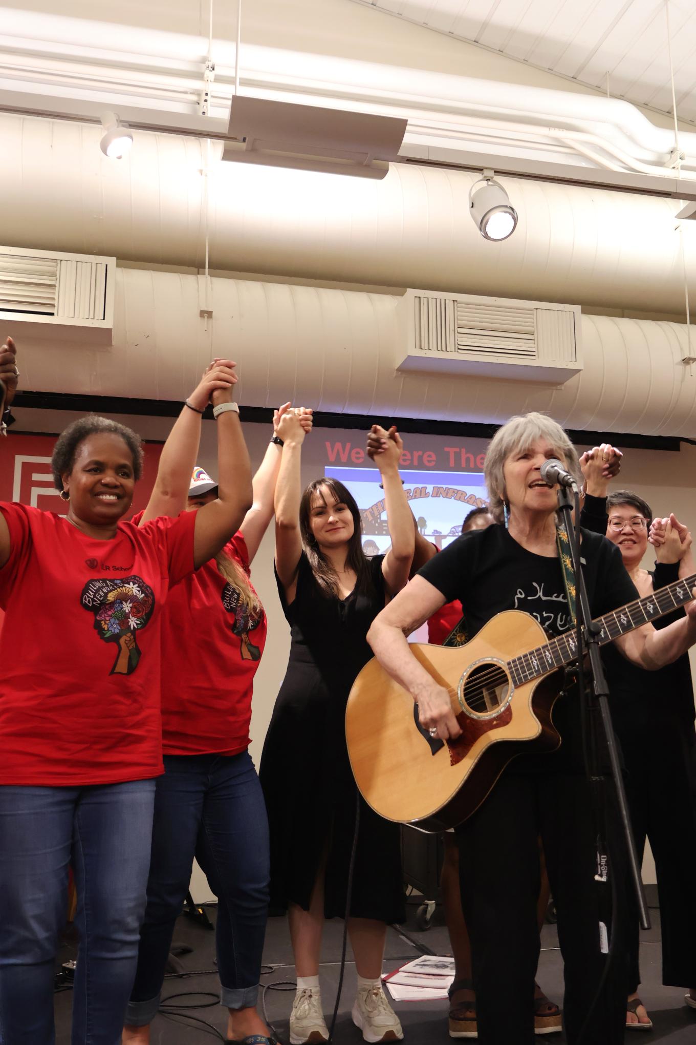 Worker siblings close out Labor History Night with a final song.