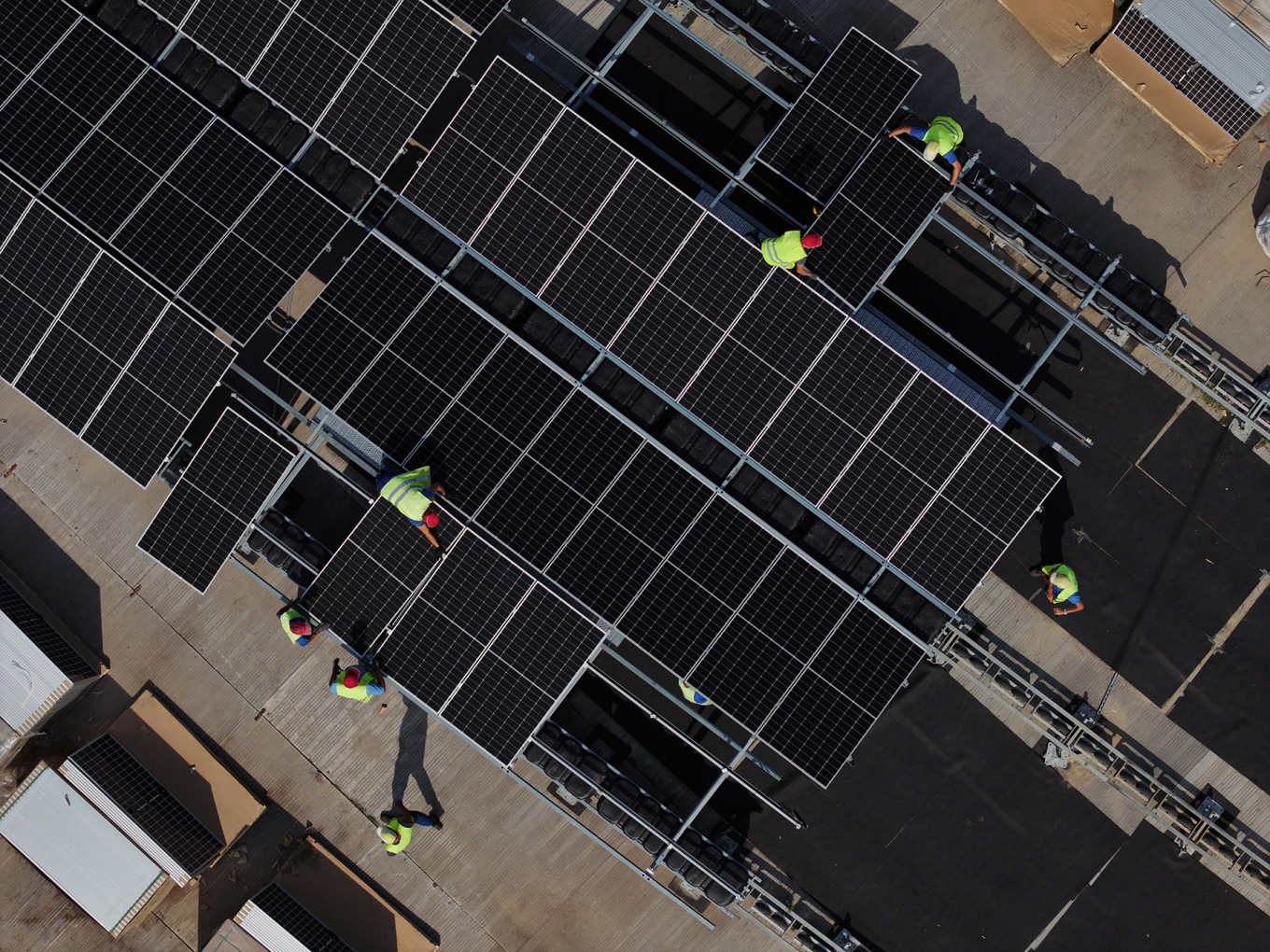 Workers installing solar panels