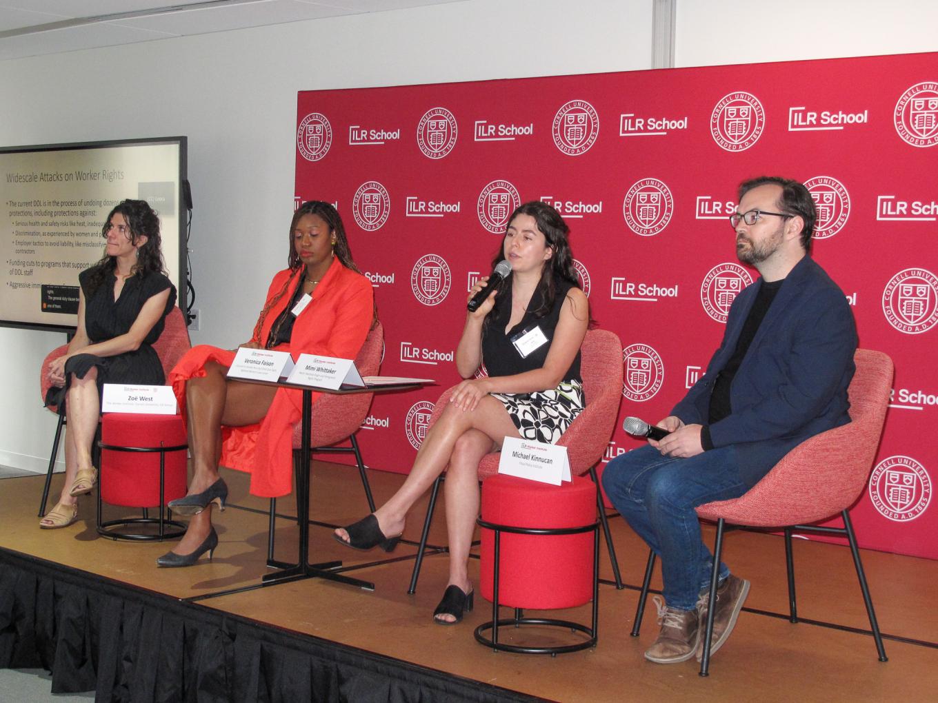 Four panelists sitting in a row