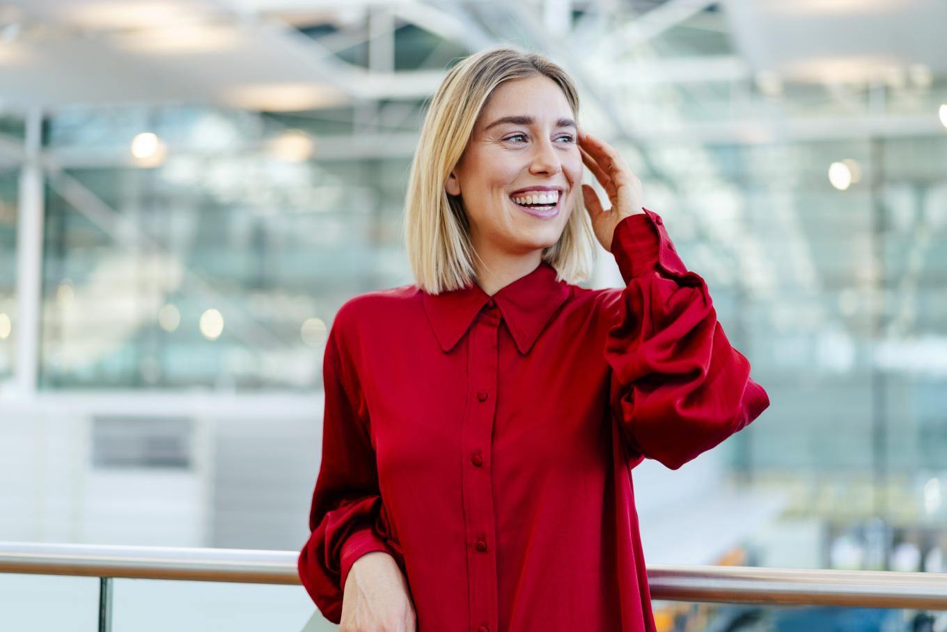 Getty stock image of HR executive in red shirt