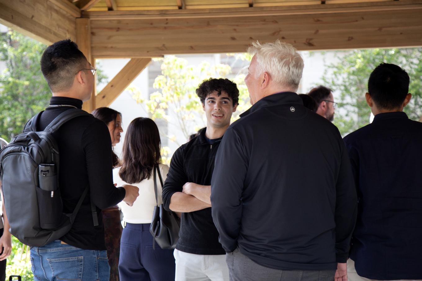 MILR students and Professor Chris Collins at a graduate programs reception