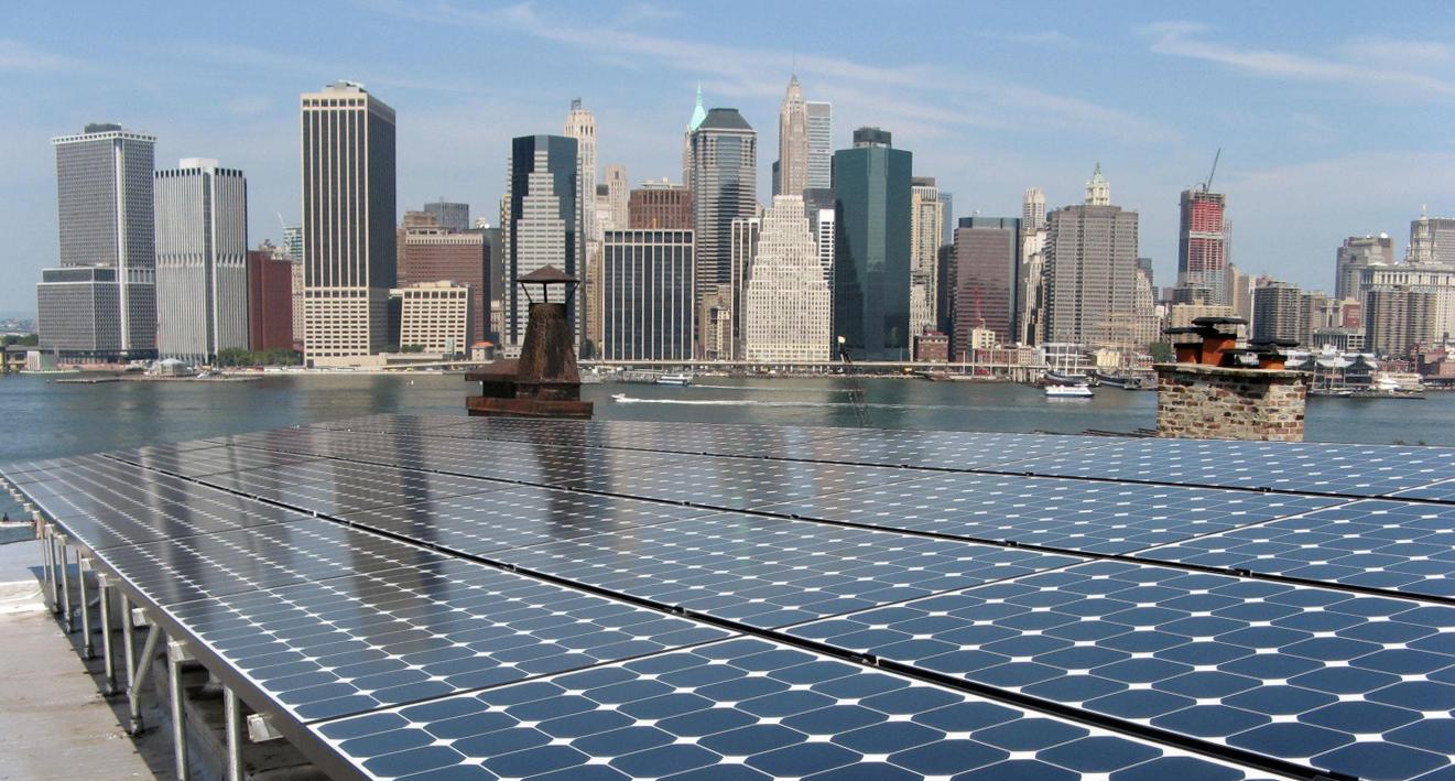 solar panels with the Hudson River and NYC skyline in the background