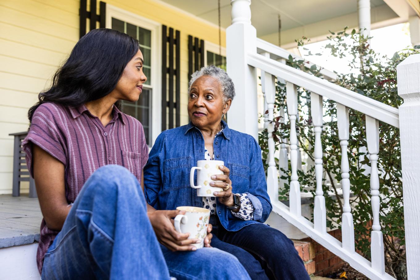  Senior woman and adult daughter having coffee on front porch of rural farm home - stock photo Senior woman and adult daughter having coffee on front porch of rural farm home