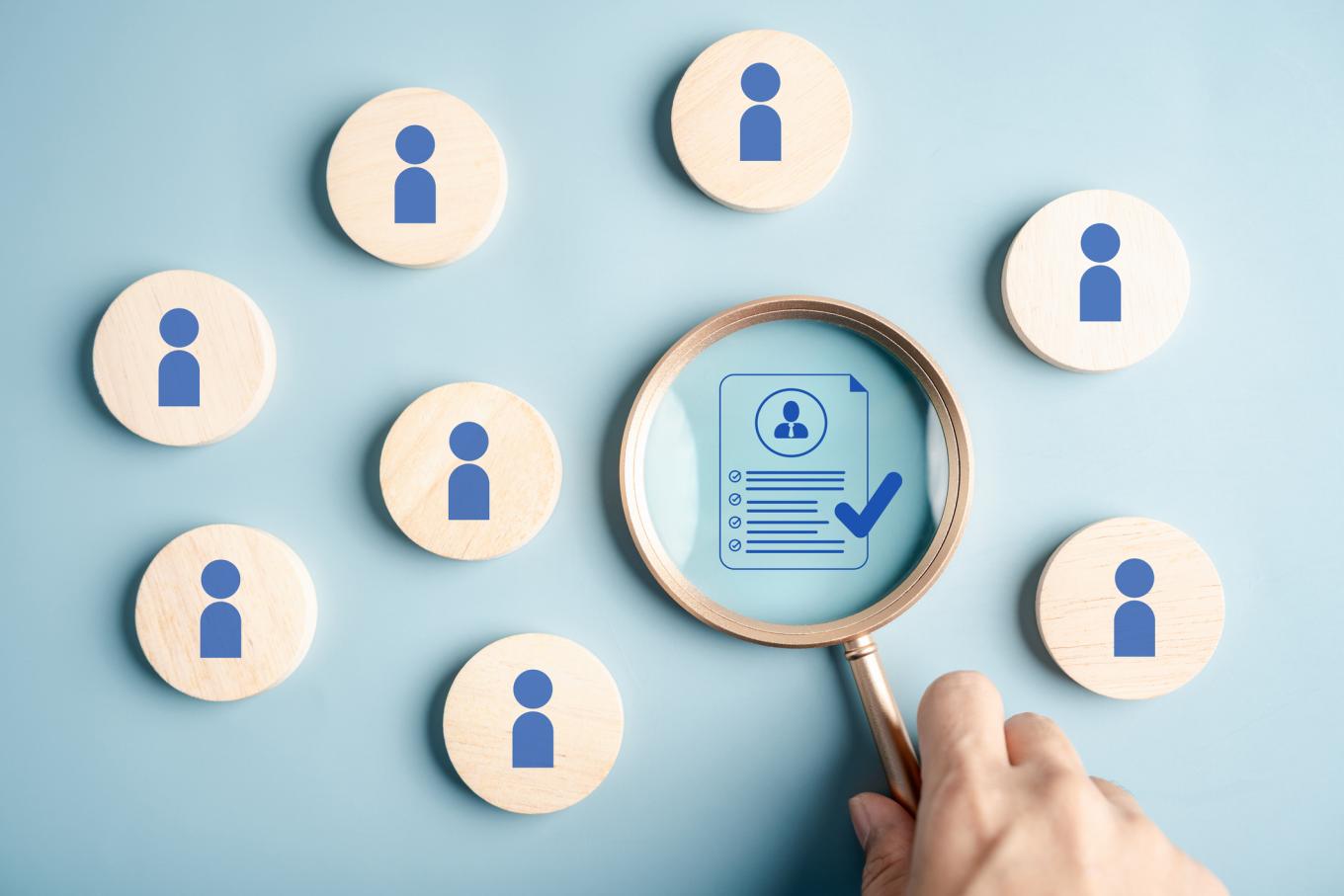 Human resource with candidate profile magnifying glass, representing recruitment, resume review, job interview, and HR hiring process.