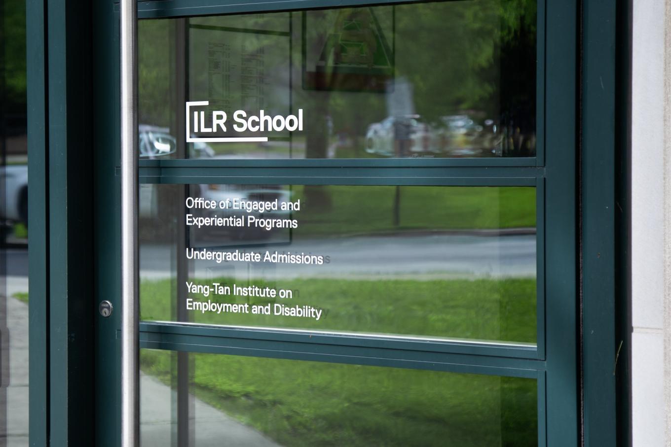 Dolgen Hall entrance with signage for OEEP, YTI and Undergraduate Admissions