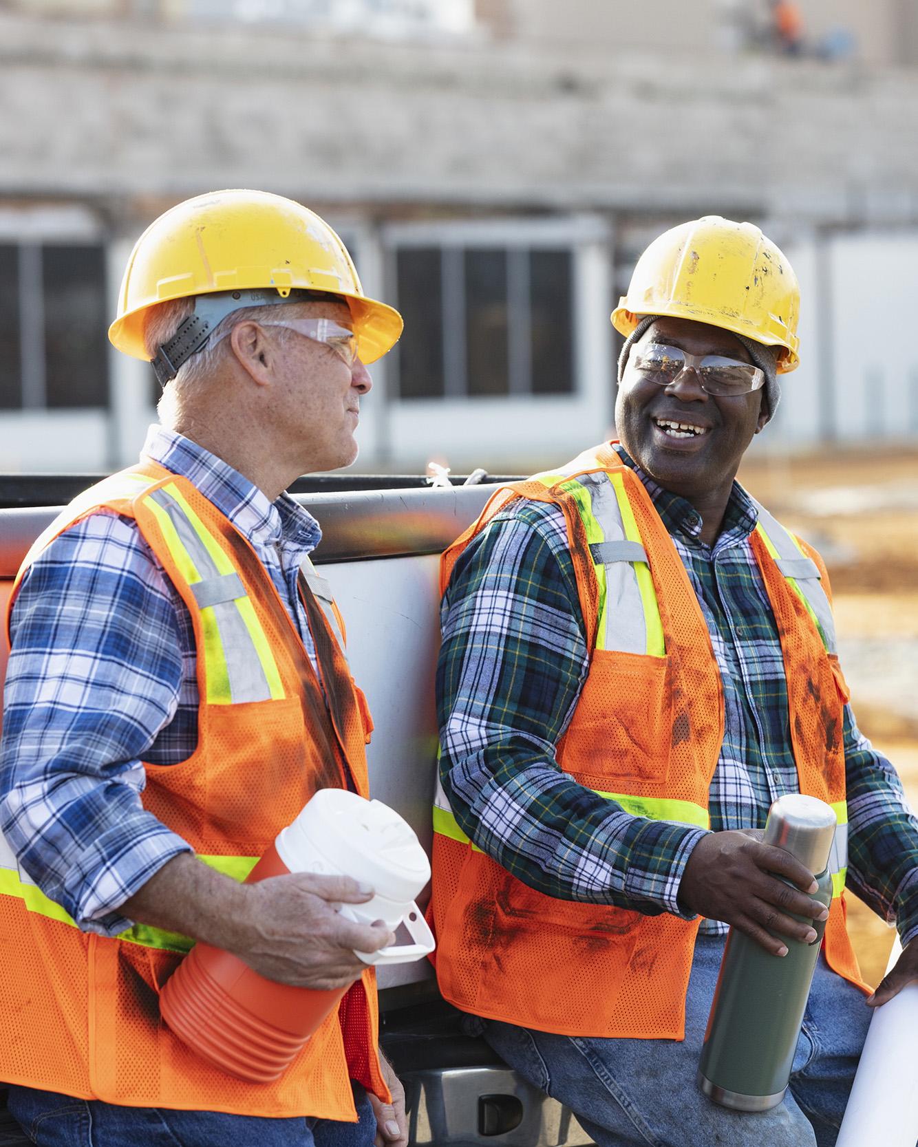 Two construction workers chatting during a break