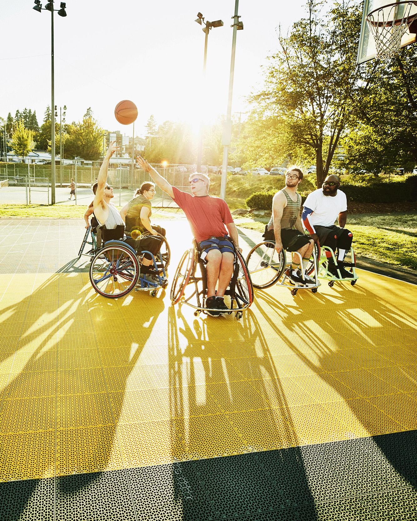 Wheelchair basketball game on an outdoor court