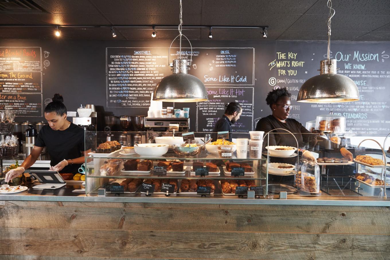 Bakery employees working behind a counter