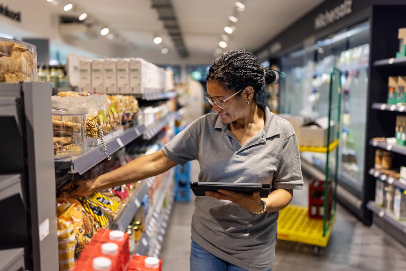 Grocery worker checking shelves