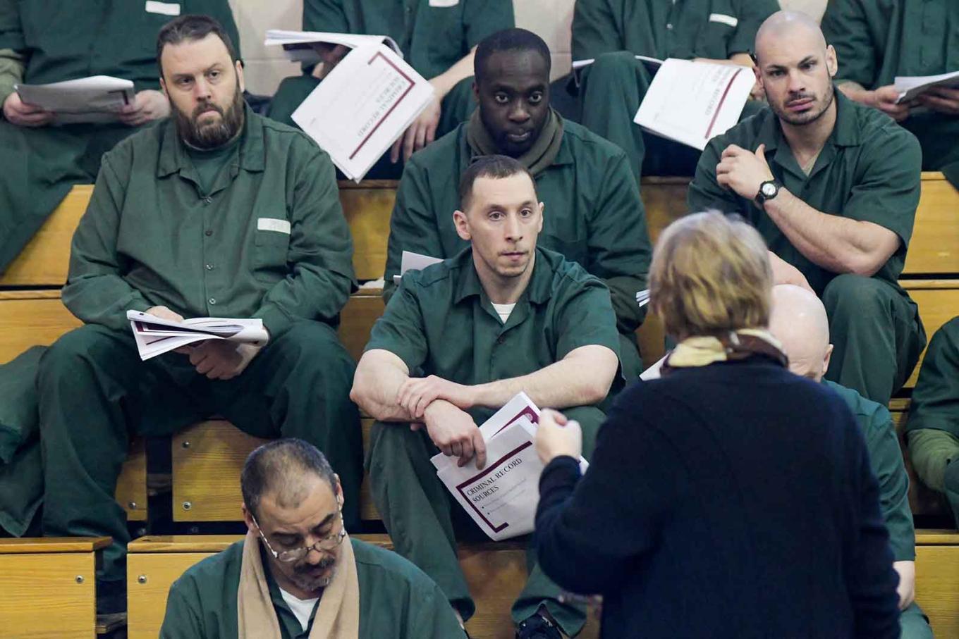 Inmates at Cayuga Correctional facility listen with great focus to Esta Bigler speak about their rights