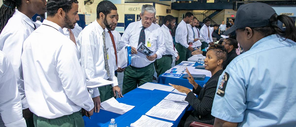 people being trained at a job fair