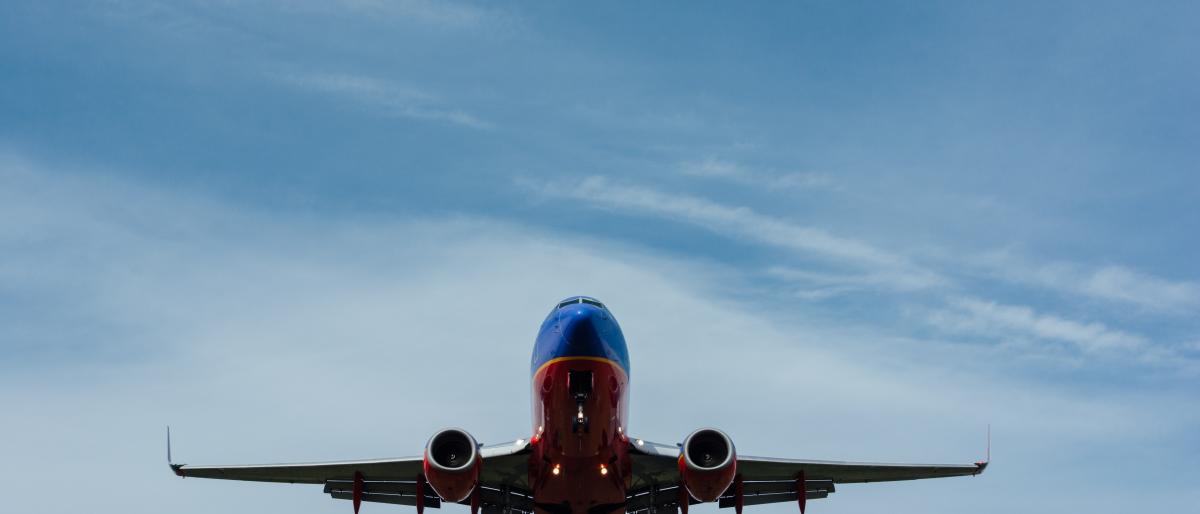 Photo of airliner in the sky by Gary Lopater on Unsplash