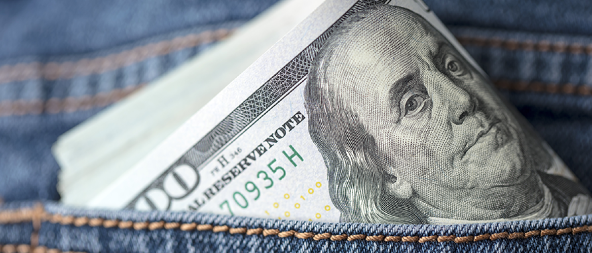 Money in the back pocket of a pair of jeans