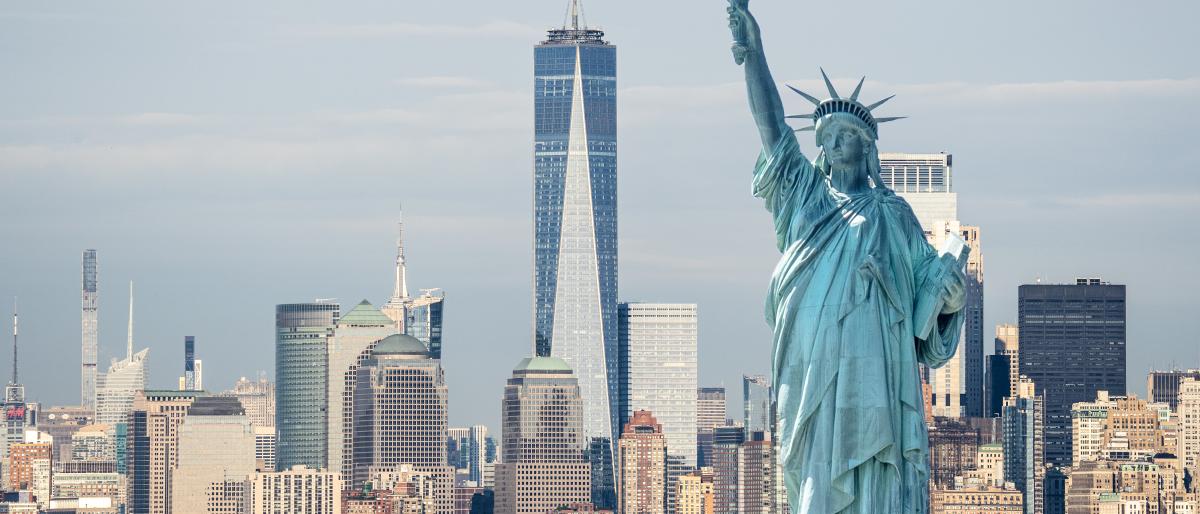 View of the statue of liberty with NYC skyline behind
