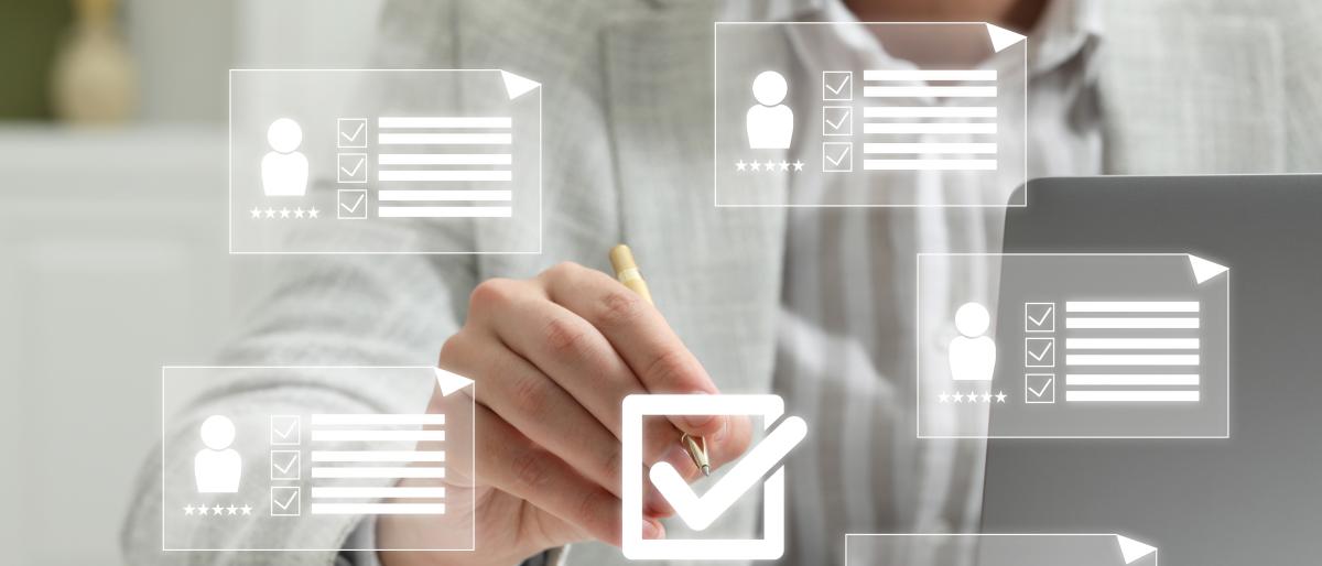 Close up of person putting check mark on virtual screen with icons