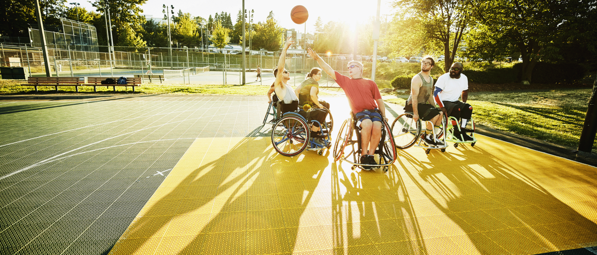 Wheelchair basketball game on an outdoor court