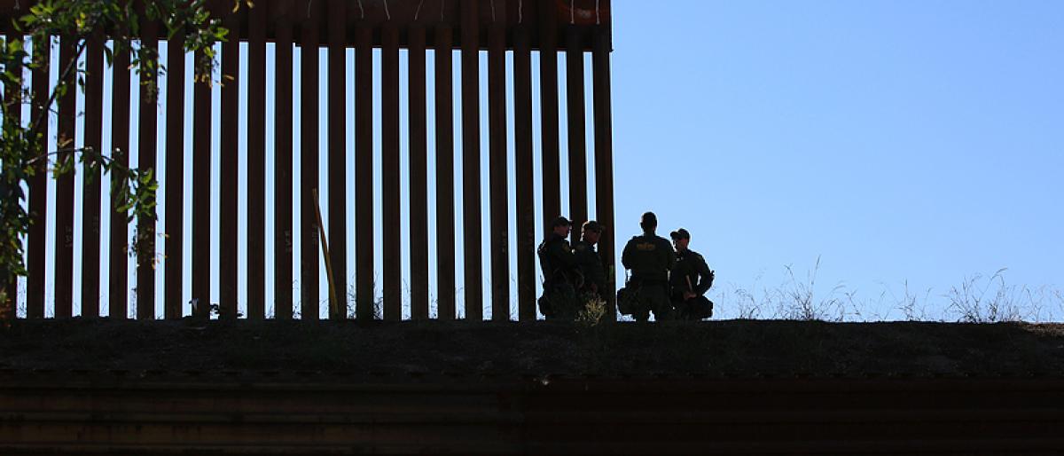 Border fence between the USA and Mexico including New Construction adding an additional layer of fencing and razor wire or barbed wire to secure the border.