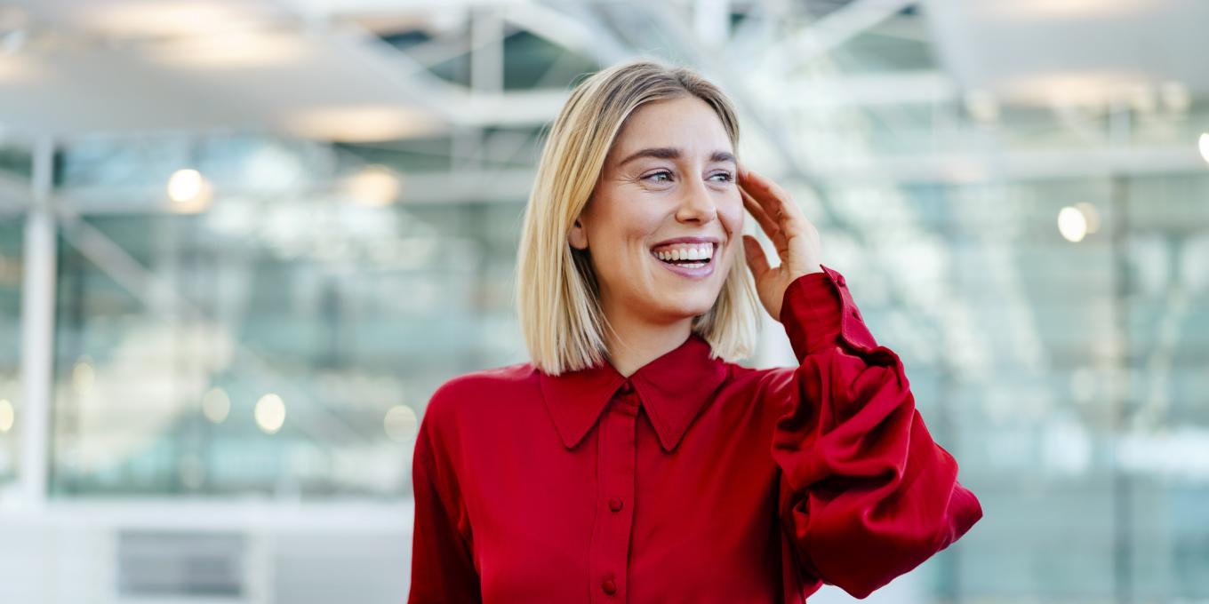 Getty stock image of HR executive in red shirt