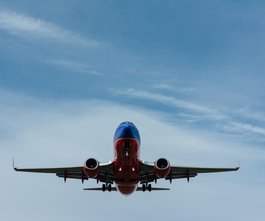 Photo of airliner in the sky by Gary Lopater on Unsplash