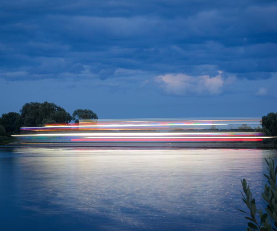 Lights blurred over a lakescape at twilight