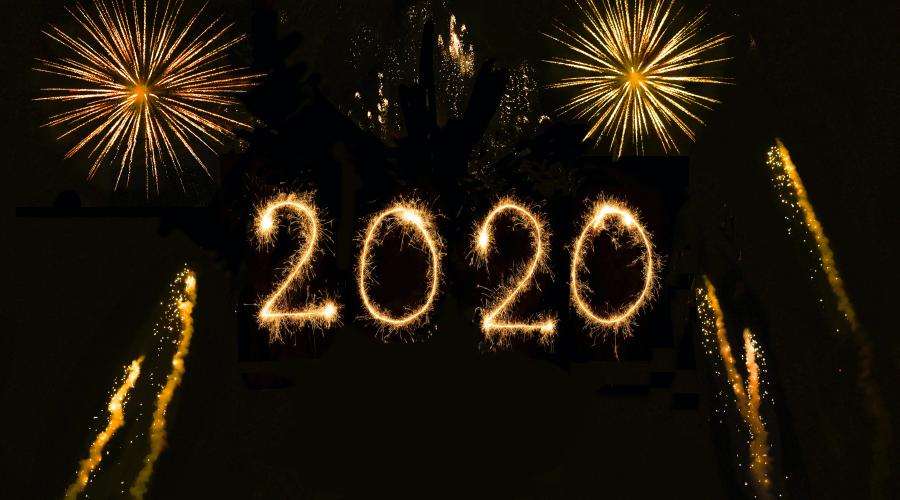 Fireworks and 2020 written in light across the night sky