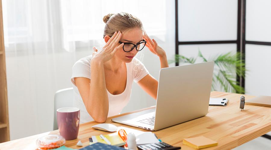 Woman working from home showing frustration