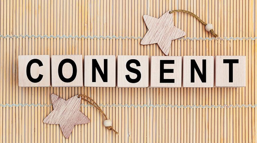 The word "consent" written on blocks