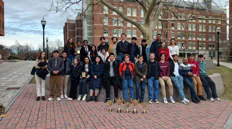 20 Cornell Debaters stand together before the tournament