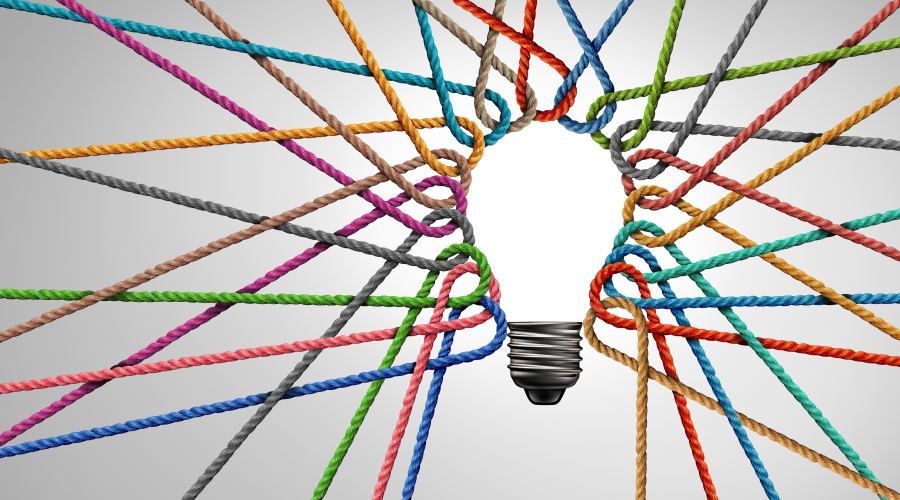 Colored string form the image of a lightbulb as a metaphor for DEI management
