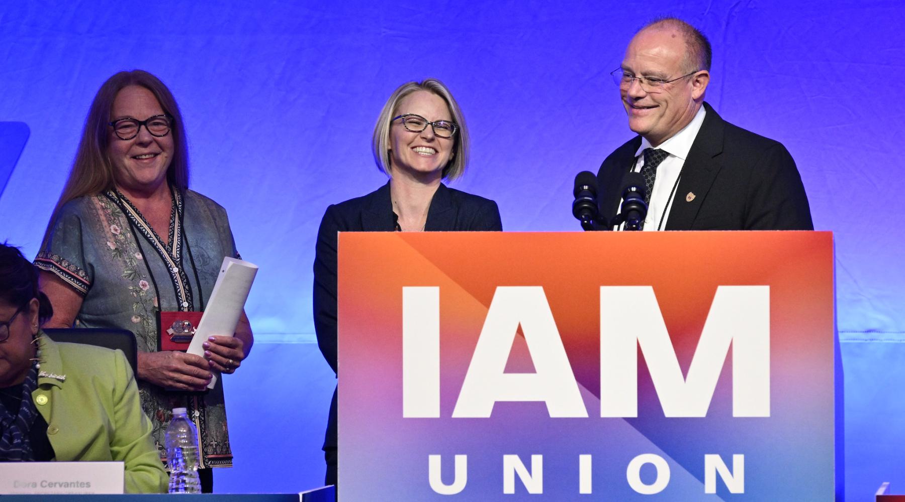 Speakers at podium of the IAM Union convention