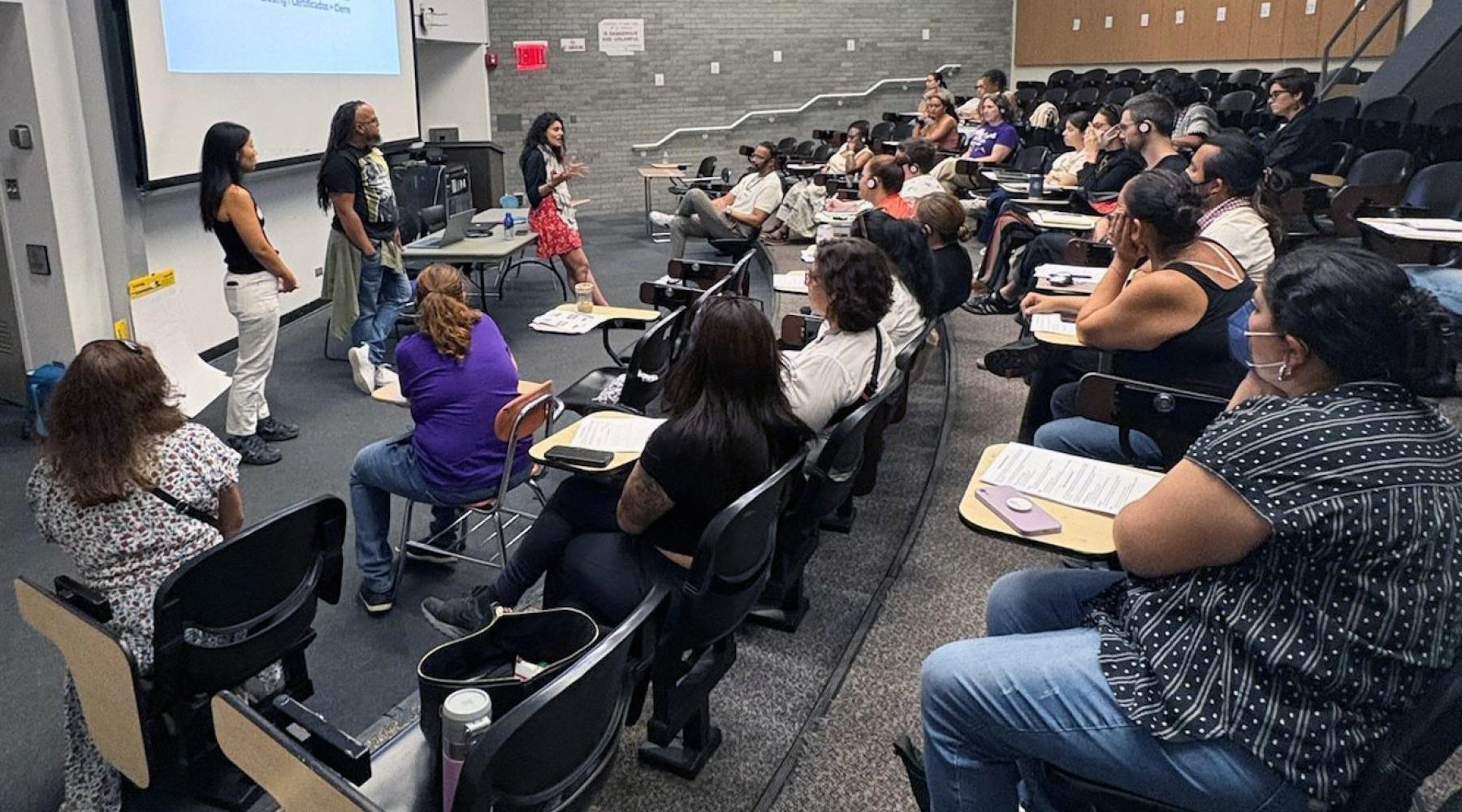 Classroom with students and teachers facilitating at the front