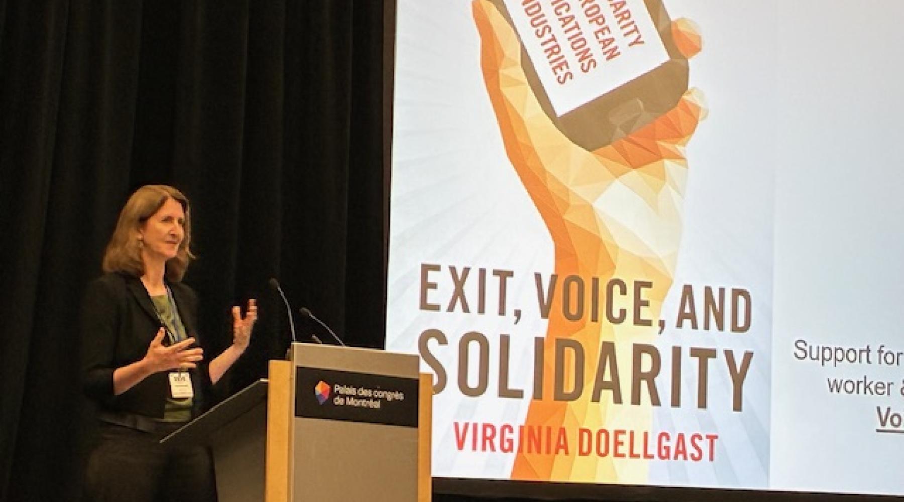 Virginia Doellgast presenting the keynote address at the 2025 SASE annual conference in Quebec.