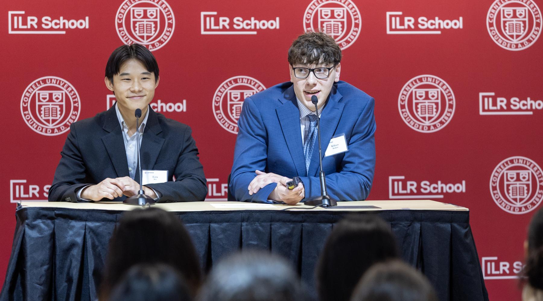Two High Road students presenting while facing audience