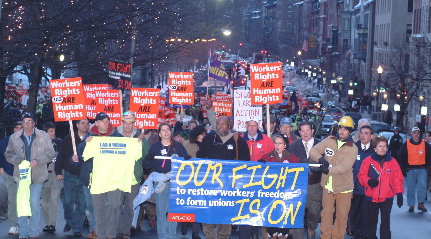 workers demonstrating on city street