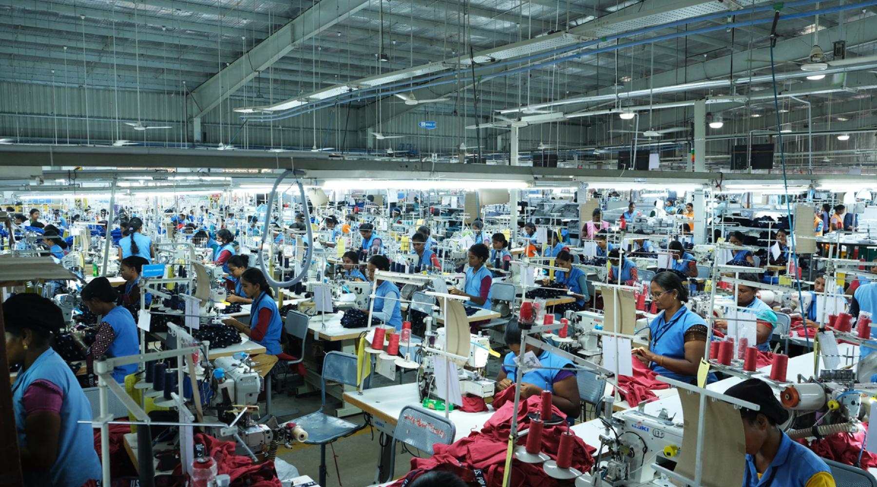 Large room of garment factory workers 