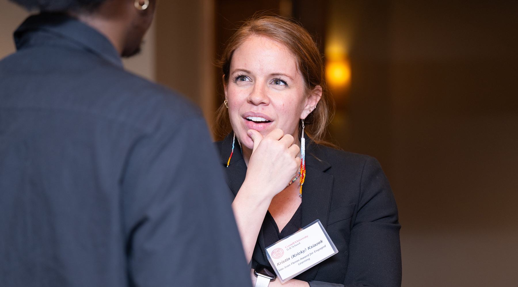 Kricky Ksiazek, M.P.A. ’13 speaks with a student at the McPherson Awards ceremony. 