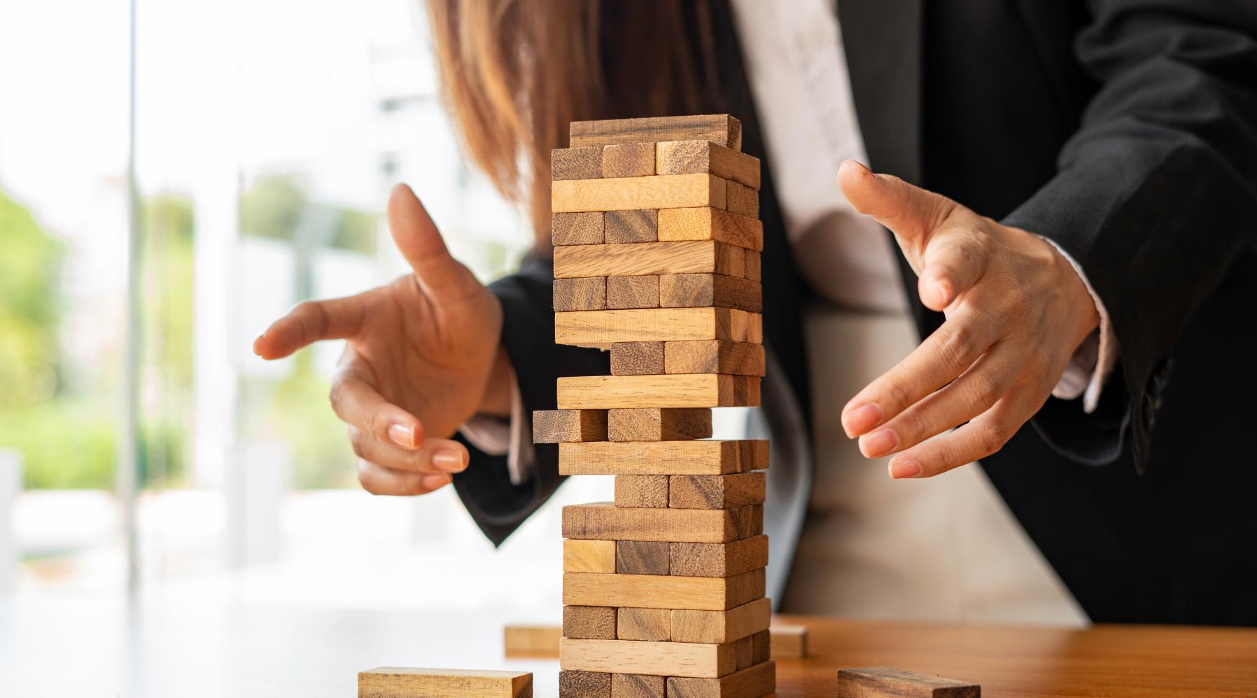 jenga representing management shift