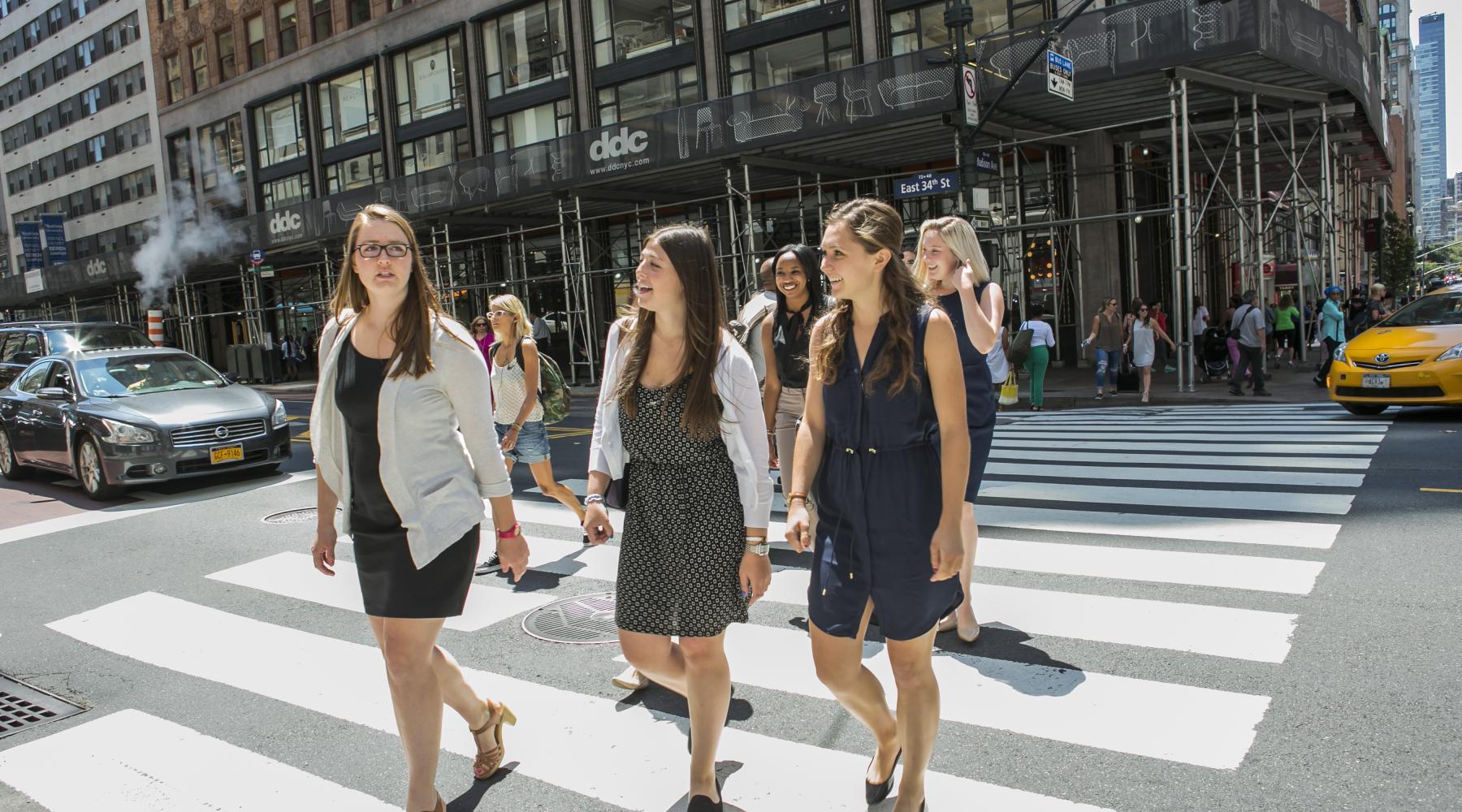ILR student interns cross a street in NYC