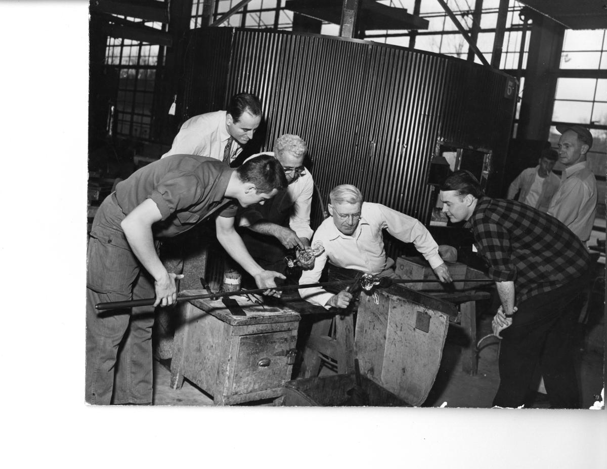 ILR students watch a glass blower at work. 