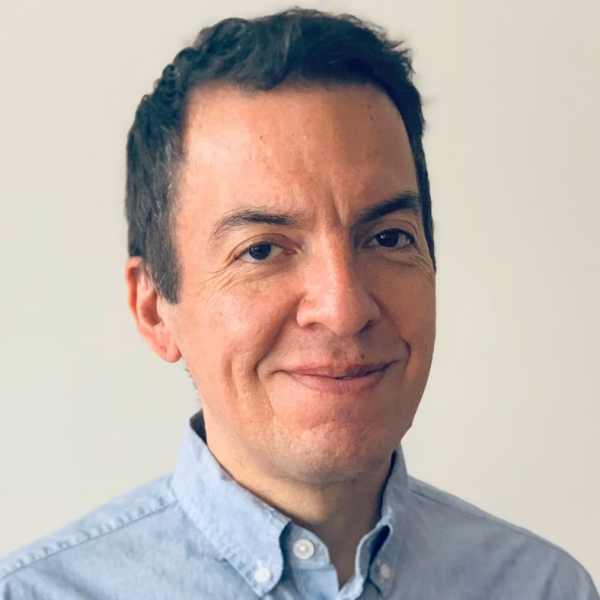 professional man smiles at camera