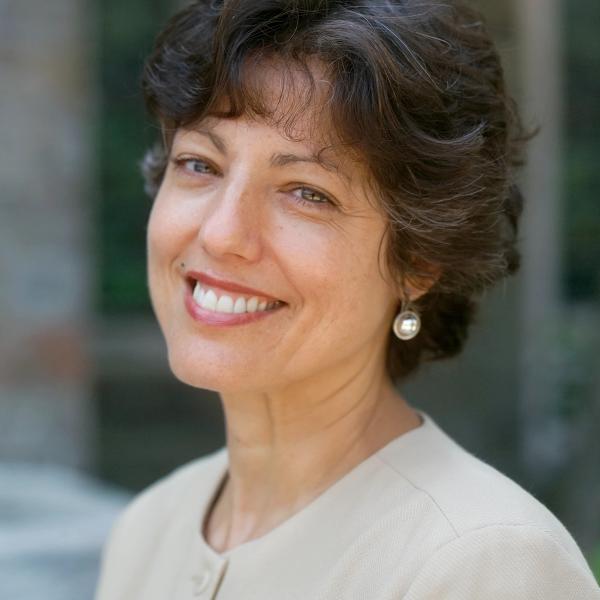 Brown hair, Caucasian woman smiling at camera