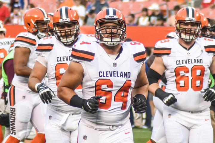 JC Tretter (#64) leads the Cleveland Browns’ offensive line onto the field (Erik Drost).