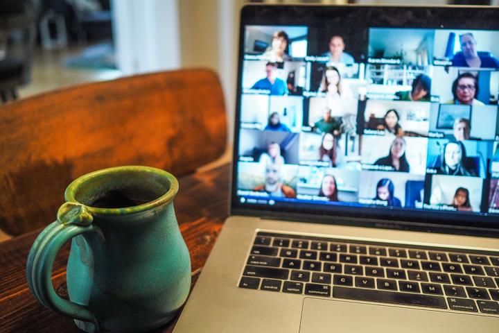 a laptop showing a video call to illustrate remote connection like an interview