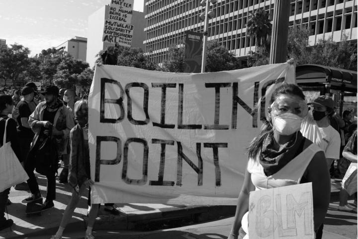 Protesters hold a sign saying "Boiling Point" during protests against the killing of George Floyd.