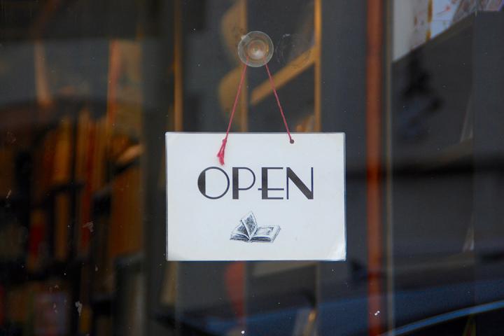 sign in a window saying: "open"
