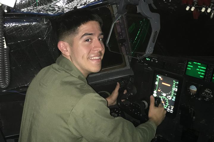  Michael Sanchez ’23 sitting in a military helicopter