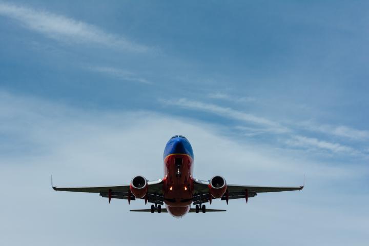 Photo of airliner in the sky by Gary Lopater on Unsplash